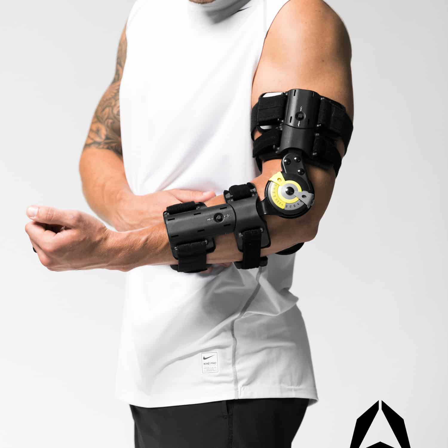 A man with a TRU-RANGE® POST-OP ELBOW brace on his arm.