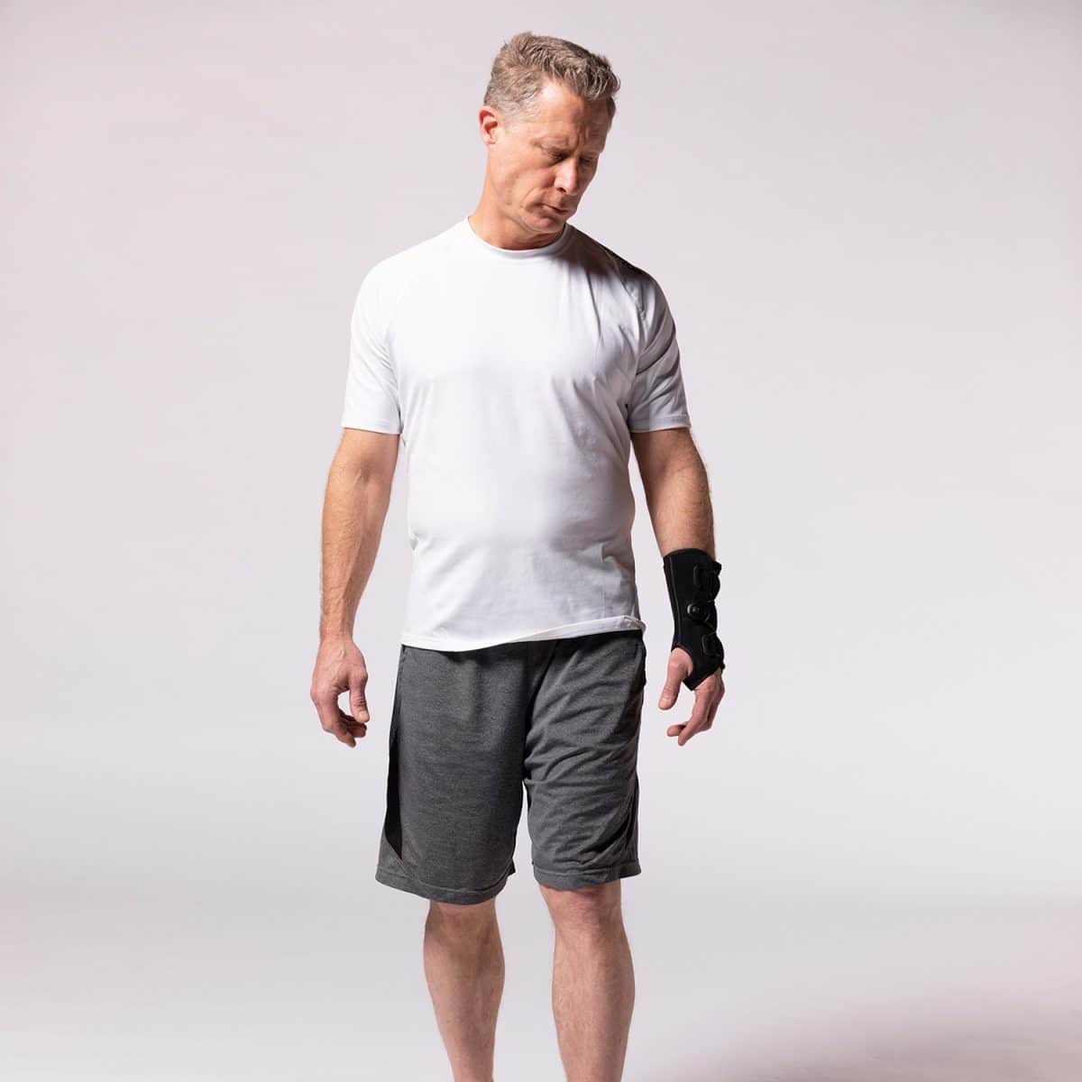 A man in PURESPEED+® WRIST and a white t-shirt.