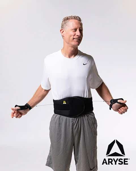 A man wearing a exercise belt.