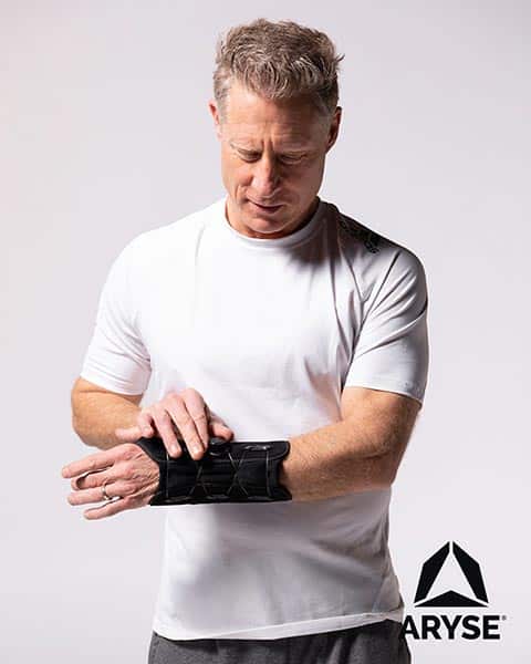 A man wearing an arse wrist brace.