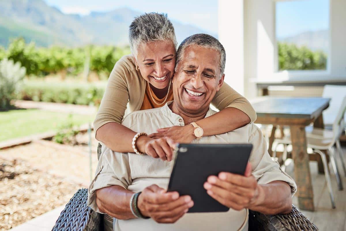 An older couple using a tablet computer.